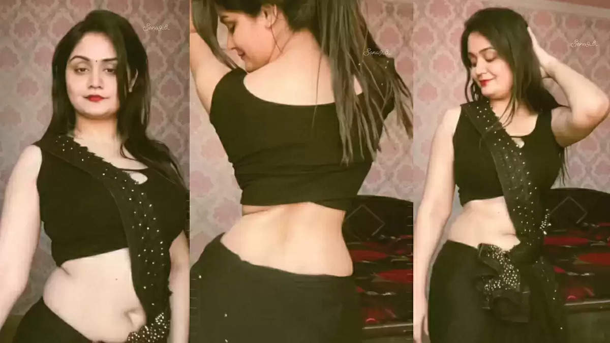 Desi Bhabhi's Sexy Moves in a Black Saree Captivate Audiences